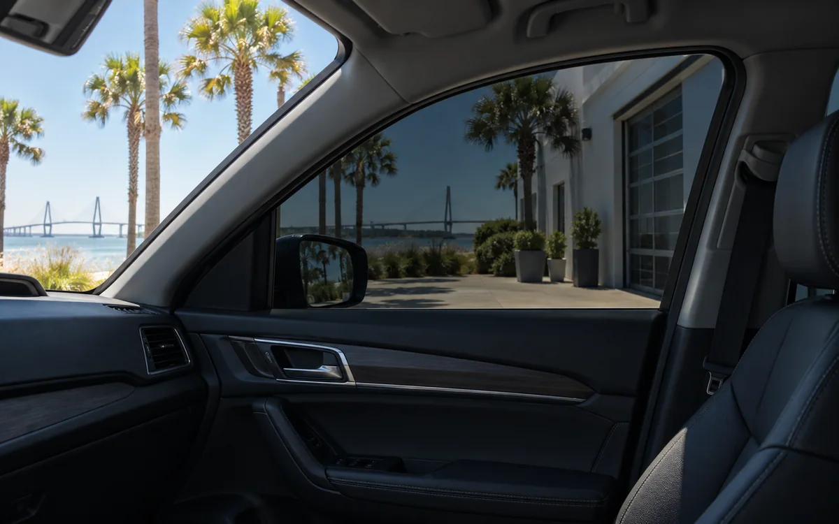 Cool shaded cabin visible behind ceramic-tinted automotive glass